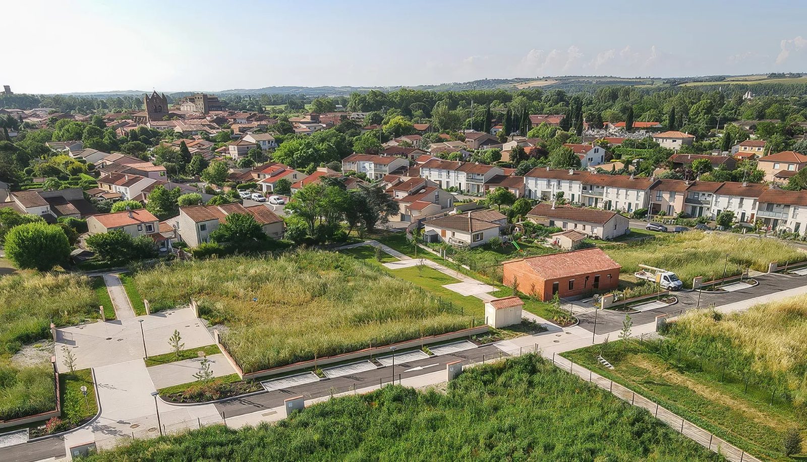 Aerial view of a two-hectare residential subdivision at Baziege with the village behind