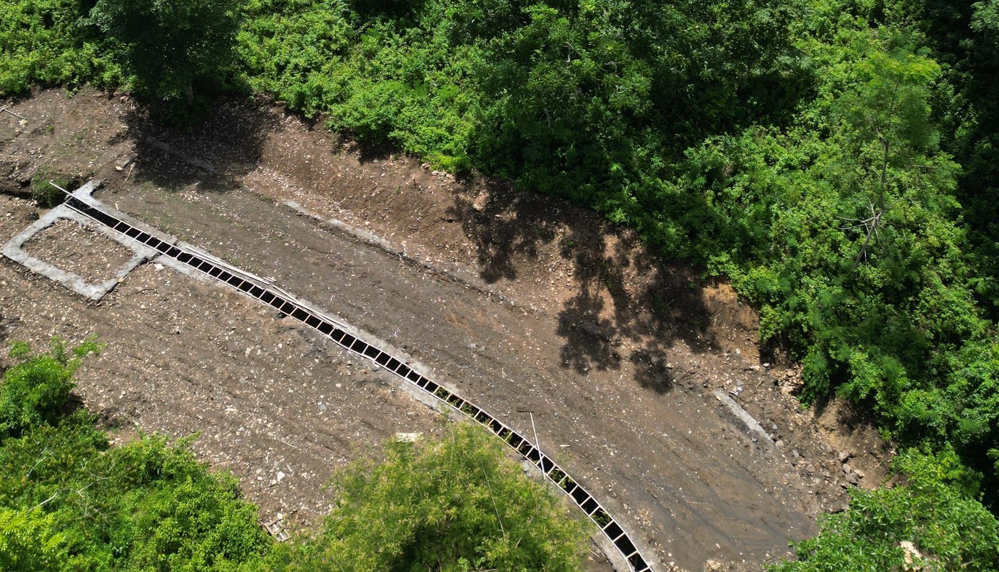 Cleared platform and drainage channel on the site at Mong